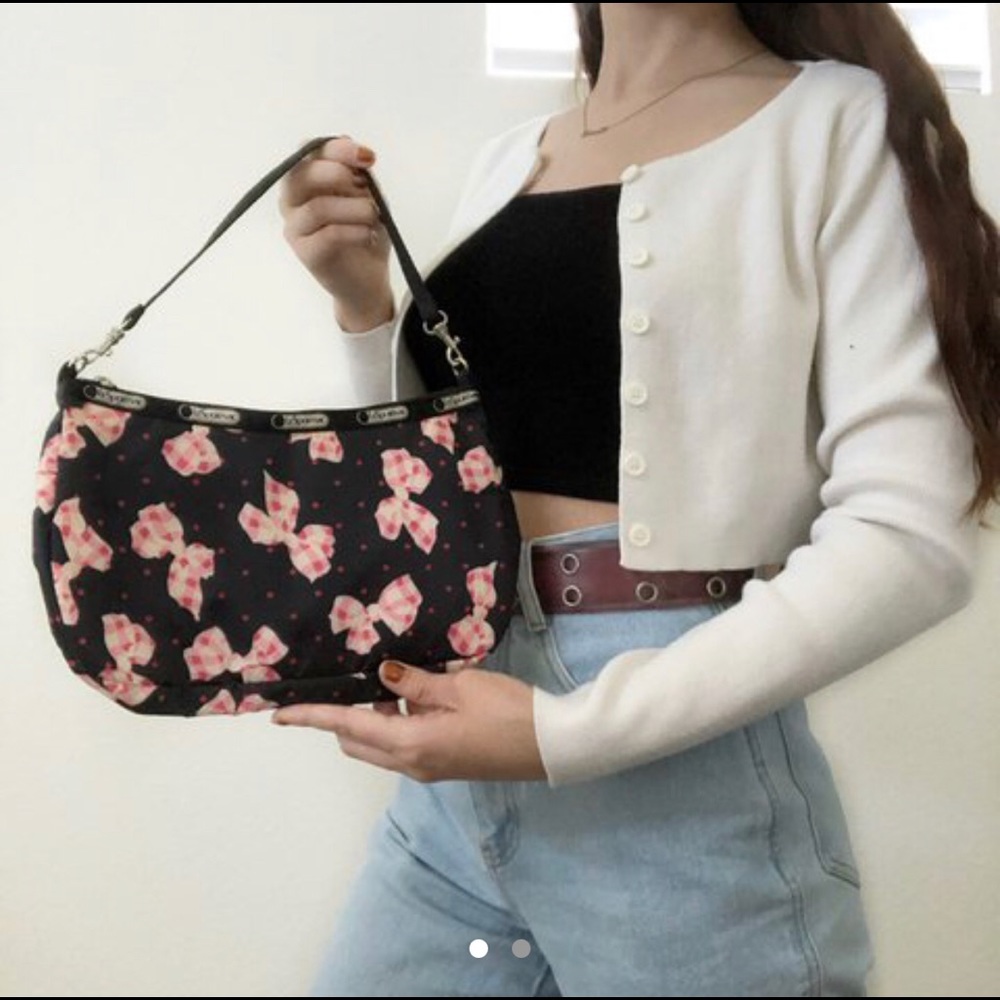 Black handbag with pink gingham bows